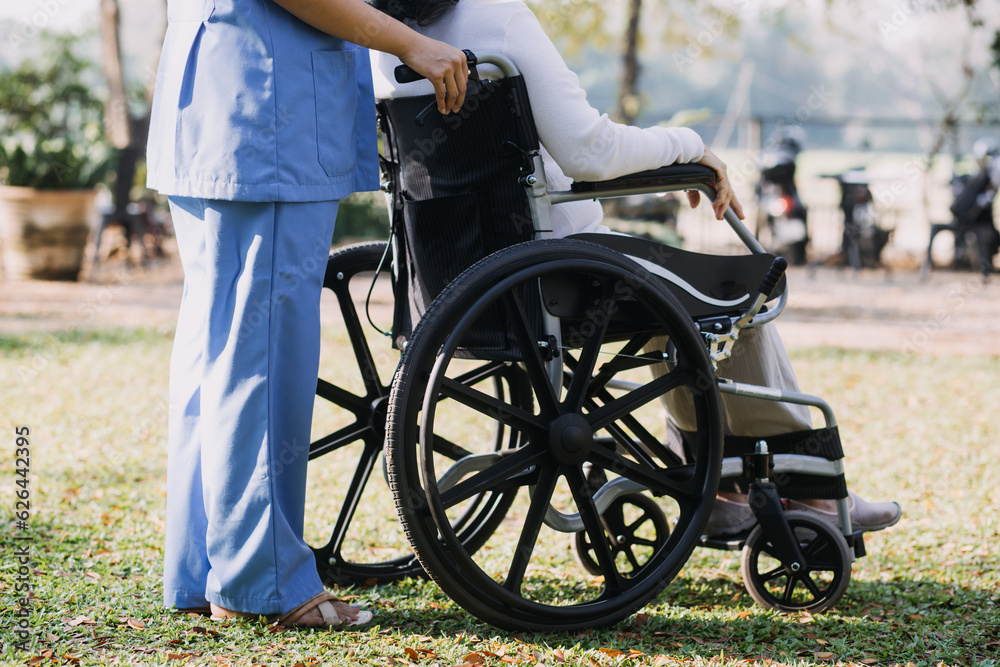 young asian physical therapist working with senior woman on walking with a walker young asian physical therapist working with senior woman on walking with a walker