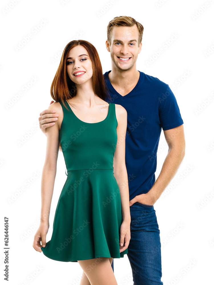 Fototapeta premium Image of smiling young couple. Full body length portrait of standing close and looking at camera models at happy in love studio concept, isolated on white background. Man and woman posing.