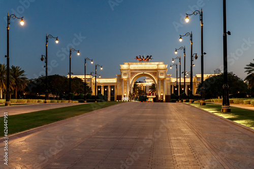 View at sunset to the decoratively decorated alley  and decorative arch in front of the Zaabeel Palace in the Dubai city, United Arab Emirates photo