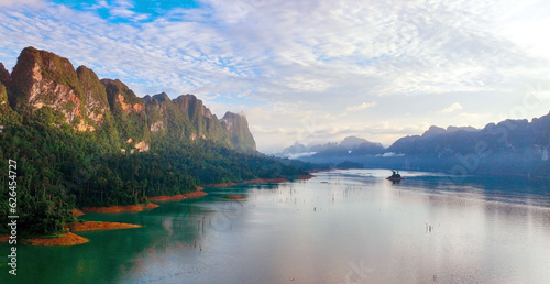 The Aerial sunset view at Khao Sok national park Cheow Lan Dam lake with blue sky background in Surat Thani, Thailand
