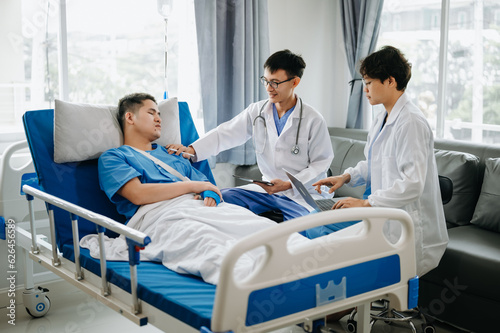 Hospital Ward Male and Femle Professional Asian Doctors Talk with a Patient  Give Health Care Advice  Recommend Treatment Plan  with Advanced Equipment .