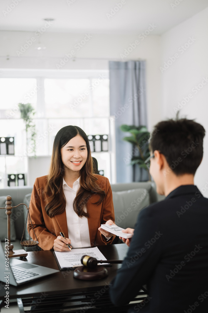 justice and law concept.passing bribe money in the envelop at office. businesswoman hand taking bribe money from male. justice and law concept.passing bribe money in the envelop at office. businesswoman hand taking bribe money from male.