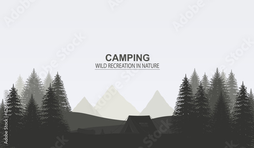 Camping in forest among  mountains with tent. Concept of outdoor recreation.