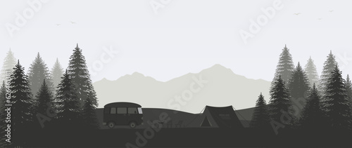 Camping in  forest among mountains with motorhome and tent. Concept outdoor recreation.