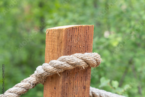 Fencepost with rope on a footpath in a forest © primestockphotograpy