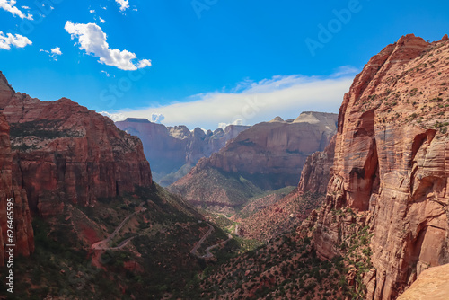 Panoramic aerial view from Zion National Park Canyon Overlook, Utah, USA. Tranquil atmosphere in wilderness. Uninhabited canyon with majestic rock formations and steep cliffs. Mountains, serene sky