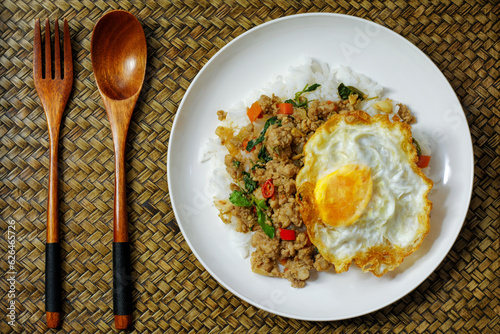 Thai food, stir-fried basil with pork and fried egg Thai popular food Spicy food, traditional Thai food concept.