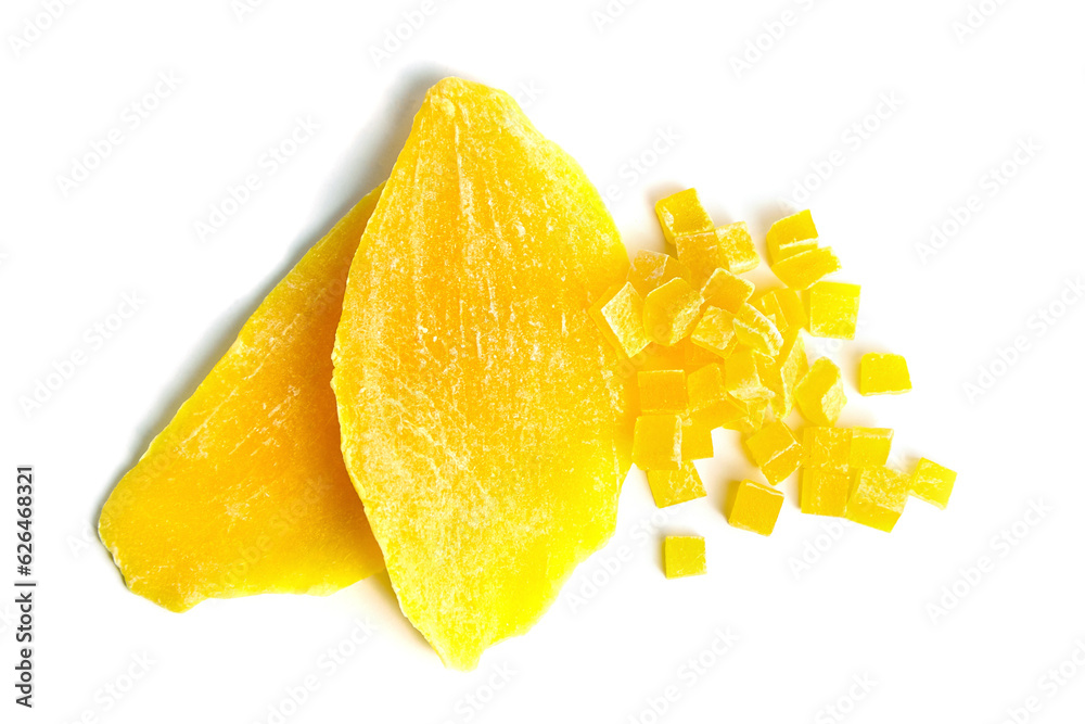 Dehydrated mango slices and cubes isolated on white. Candied diced mango fruits closeup Dehydrated mango slices and cubes isolated on white. Candied diced mango fruits closeup