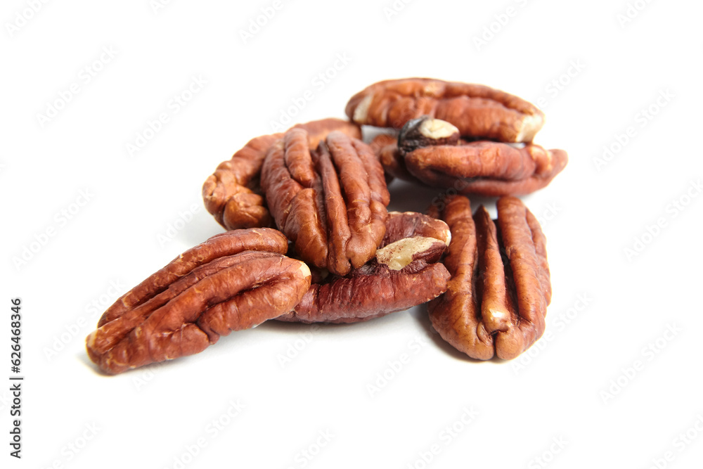 Peeled pecan nuts isolated on a white background. Heap of pecan halves Peeled pecan nuts isolated on a white background. Heap of pecan halves