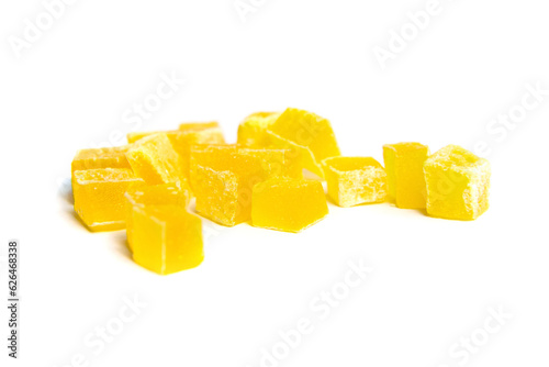 Diced mango dried fruits isolated on white background. Dehydrated mango chips dices