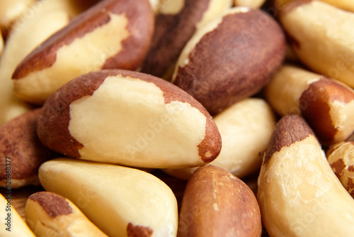 фотографія Brazil nuts closeup background. Shelled brazil nuts