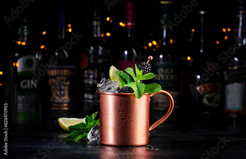 Canvas Print Blackberry Moscow mule alcoholic cocktail drink in copper mug with lime, ice, ginger beer, vodka and mint