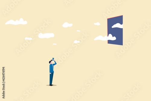 Businessman with megaphone look the sky. concept of idea of freedom, change, dream and motivation photo