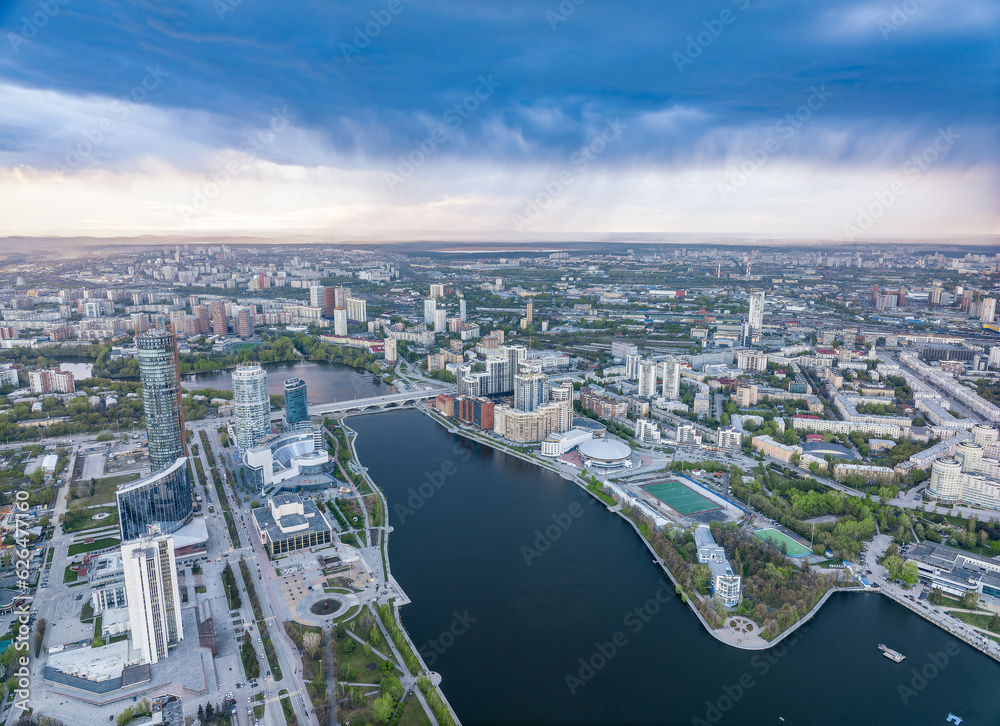 Fototapeta premium Yekaterinburg city and pond aerial panoramic view at summer sunset.