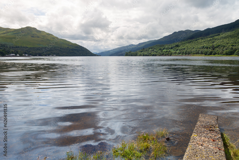 Fototapeta premium Beautiful Loch Long and the town of Arrochar in the Scottish Highlands on a sunny summers day 