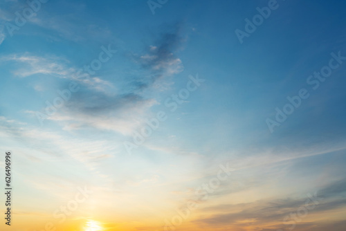 summer evening  sunset in yellow  orange and pink with clouds  background