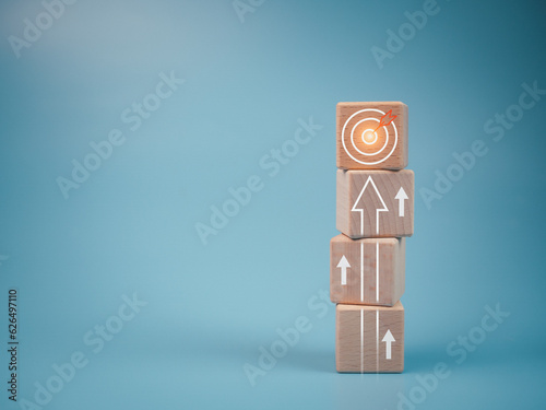 Wood cube block stacking with icon.Concept of business strategy and goal action plan.