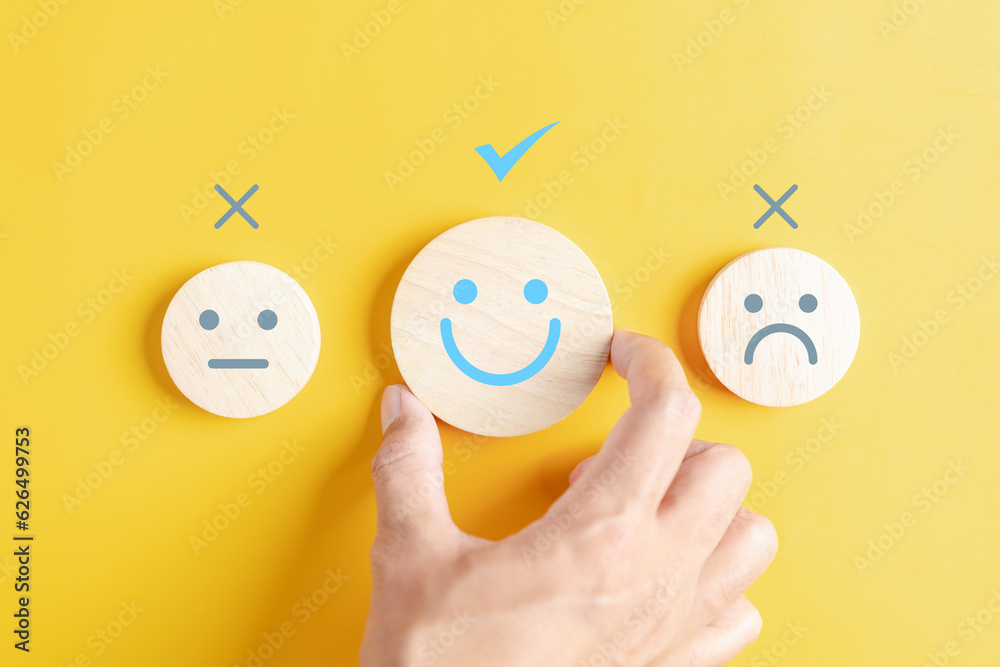 Hands holding blue happy smile face among sad face mental health positive thinking and growth mindset, mental health care recovery to happiness emotion. - obrazy, fototapety, plakaty 