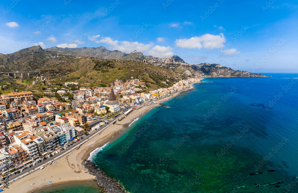 View with Giardini Naxos and Taormina, Sicily. Beach and sea in summer