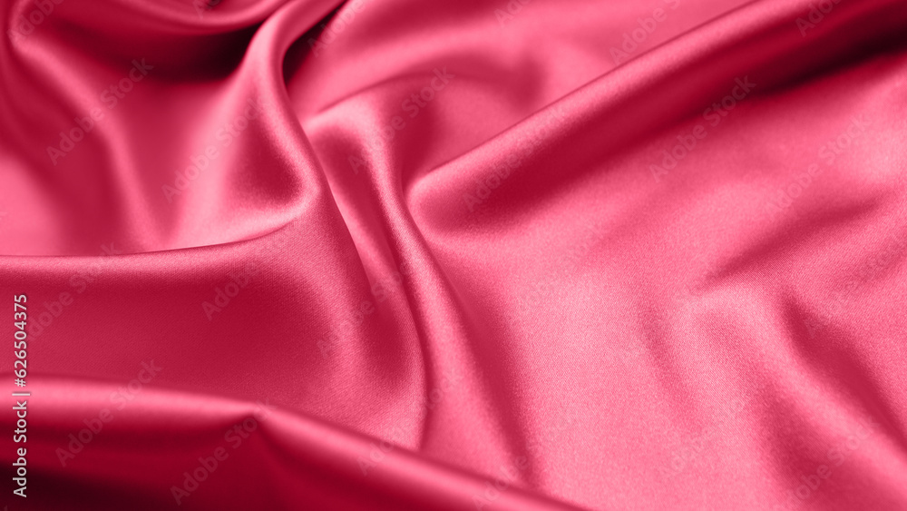 Obraz premium Viva Magenta toned red magenta fabric atlas. Close up pink silk satin texture for sewing. Abstract background wallpaper. Twisted folds cloth. Trendy color of the year 2023. Fashion color pattern