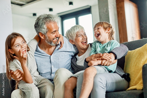 Canvas Print grandchild family child grandparent grandfather happy together grandmother girl