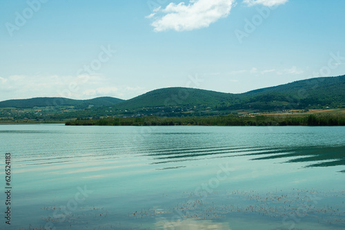 blue lake  mountains and blue sky with white clouds in summertime