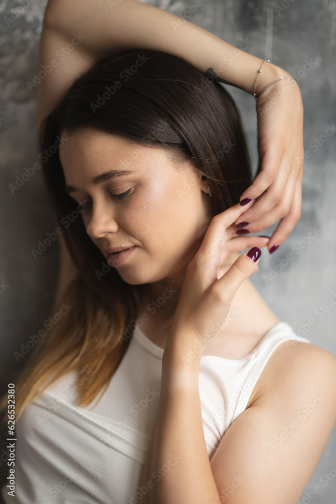 Portrait of an attractive girl with a charming smile. Oriental girl. Large female portrait. Lifestyle Portrait of an attractive girl with a charming smile. Oriental girl. Large female portrait. Lifestyle