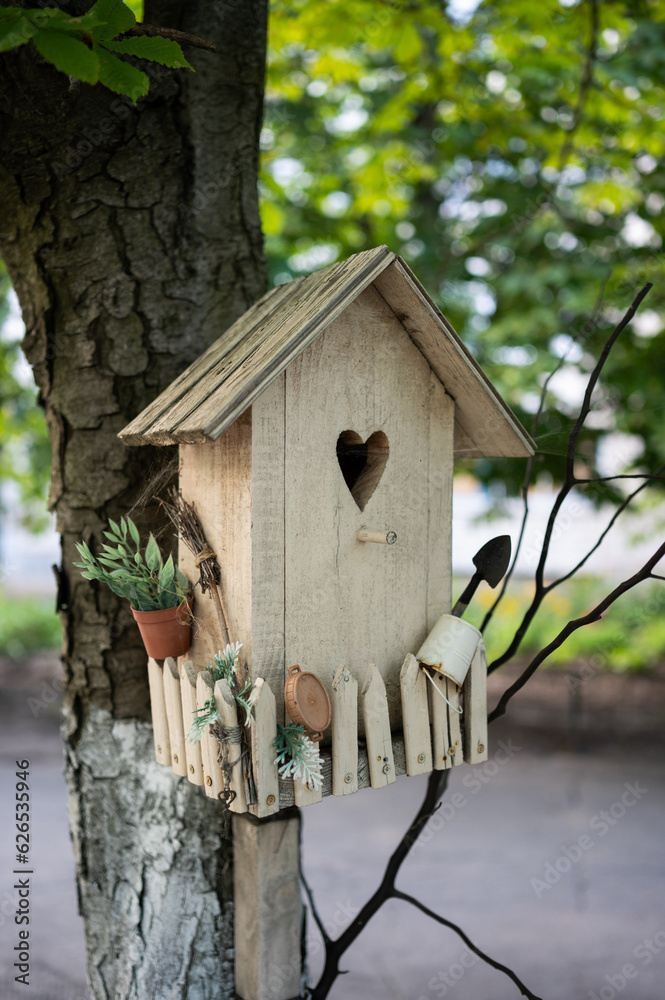 wooden birdhouse, bird house on a tree
