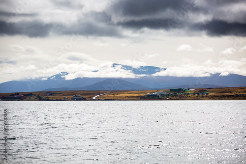 Panoramic landscape in Patagonia with sea and mountains and cloudy sky  Puerto Natales  Chili