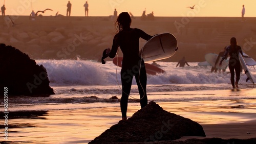 Wallpaper Mural Silhouettes of Surfers Walking on Atlantic Ocean Coast at Sunset in Morocco Torontodigital.ca