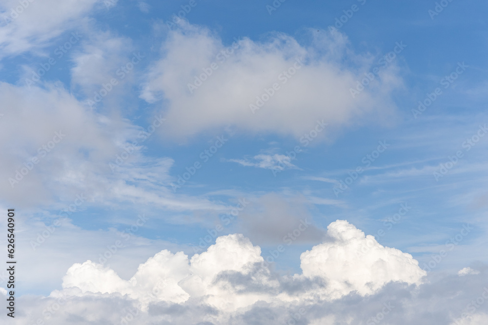 Clear blue sky with white clouds in summer in Thailand.
Clear blue sky with white clouds in summer in Thailand.