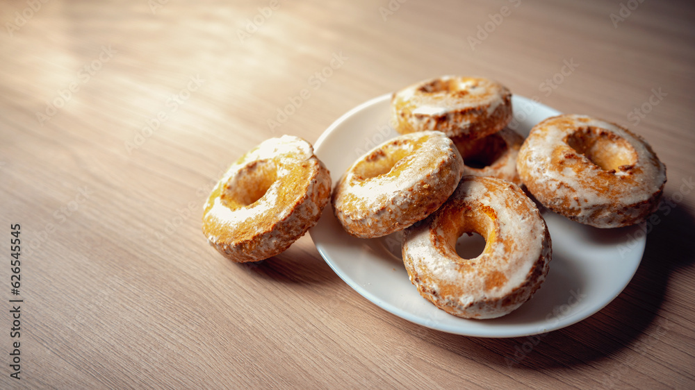 A pile of round gingerbread cakes sprinkled with powdered sugar. Warm, homely defocused background with space to copy.
