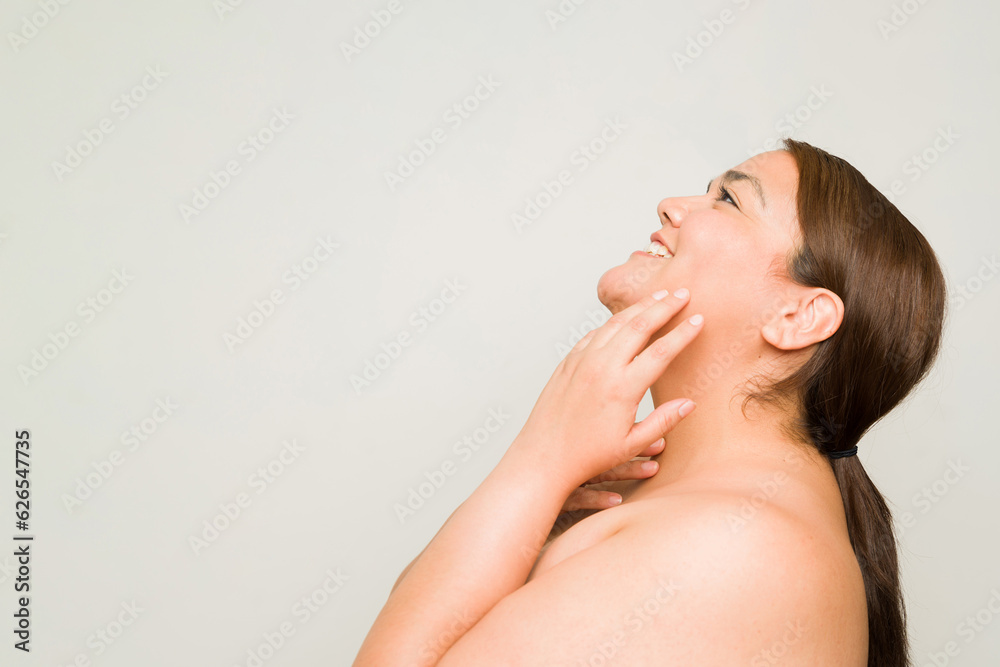 Cheerful overweight woman smiling on her beauty concept Cheerful overweight woman smiling on her beauty concept