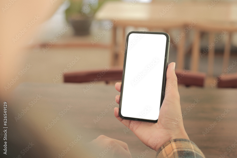 cell phone blank white screen mockup.hand holding texting using mobile on desk at office.background empty space for advertise.work people contact marketing business,technology cell phone blank white screen mockup.hand holding texting using mobile on desk at office.background empty space for advertise.work people contact marketing business,technology