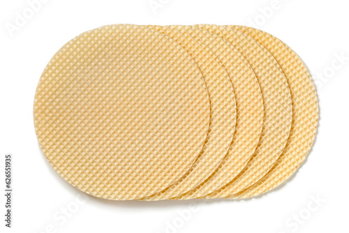 Row of fresh round Polish waffle tortowe isolated on white background close up