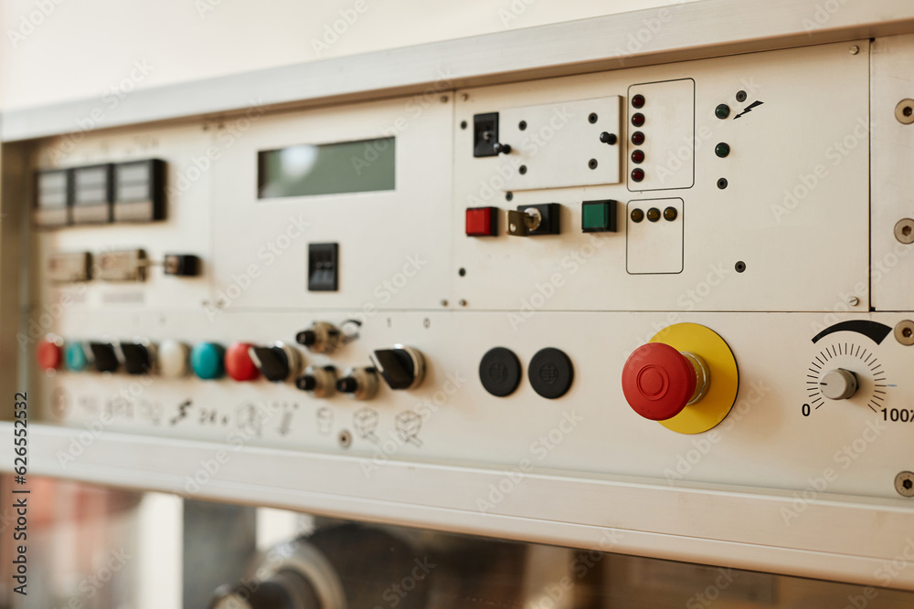 Background image of machine control panel with switches and buttons on factory equipment, copy space