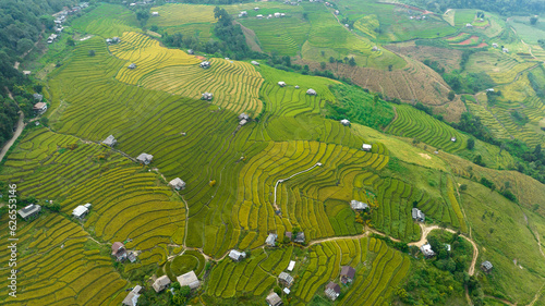 landscape for background of rice terraces field by harvesting season, at Ban Pa Bong Piang Chiang Mai Province, Northern of Thailand, aerial vie