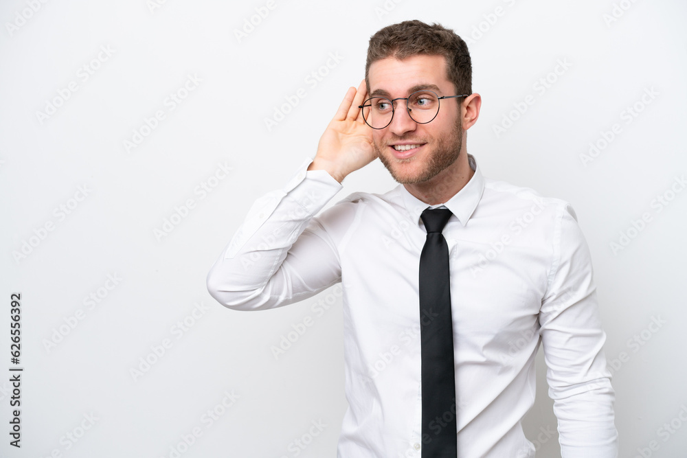 Young business caucasian man isolated on white background listening to something by putting hand on the ear Young business caucasian man isolated on white background listening to something by putting hand on the ear