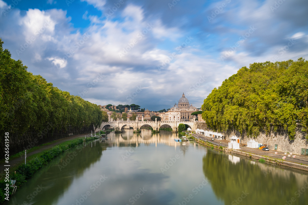 St.Peter's basilica viewed across Tiber river in Vatican in Rome. Italy