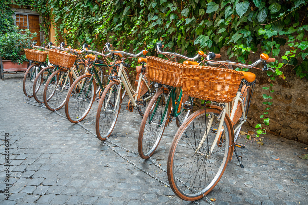 Row of classic bicycles at the narrow street in Rome