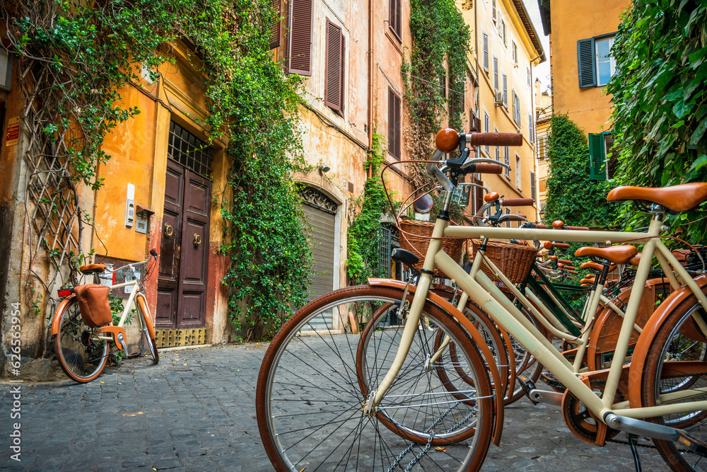 Row of classic bicycles at the narrow street in Rome Row of classic bicycles at the narrow street in Rome