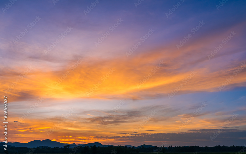 sunset sky in the evening over mountains