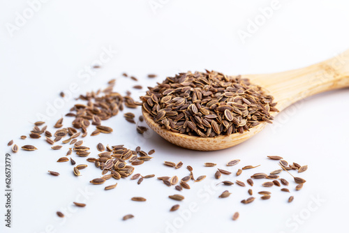 Dill, European Dill ,American Dill (Anethum graveolens  L.) in wooden spoon. Dried herb seeds isolated in white background.