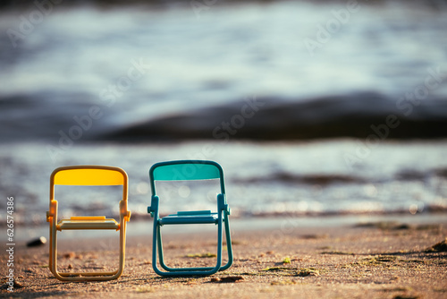 Two chairs by the sea. The concept of outdoor recreation. Beach chairs provide an opportunity to enjoy solitude with nature, surrounded by the beauty of the sea coast.