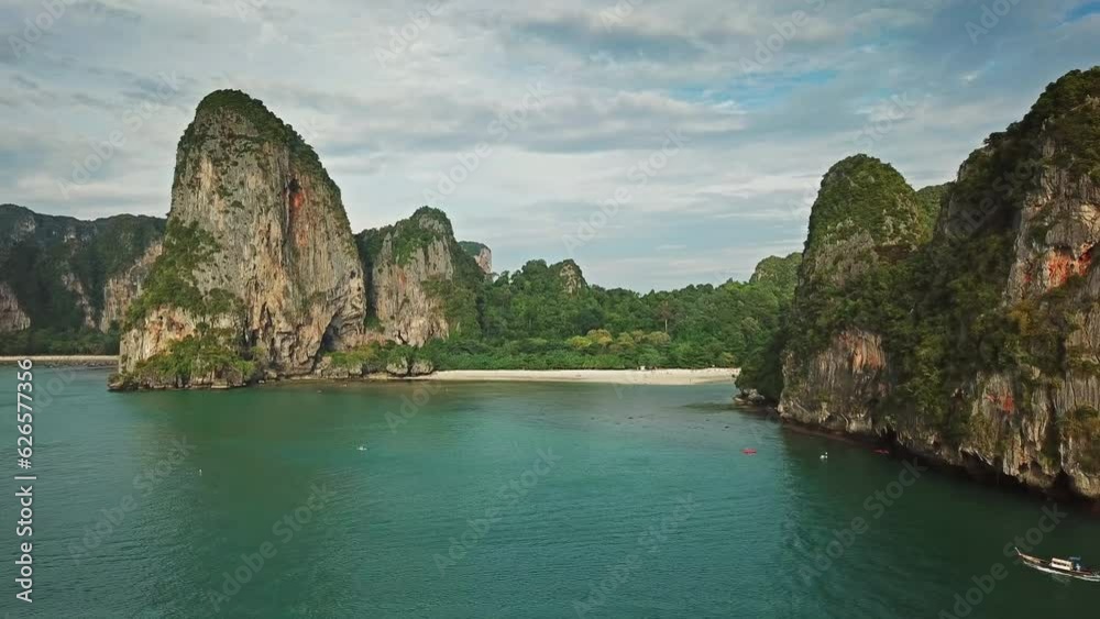 Aerial view of tropical turquoise lagoon, Pranang beach between rocks, Krabi, Railay, Thailand, 4k Aerial view of tropical turquoise lagoon, Pranang beach between rocks, Krabi, Railay, Thailand, 4k