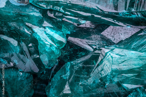 Dioptase crystal macro detail texture background. close-up raw rough unpolished semi-precious gemstone
