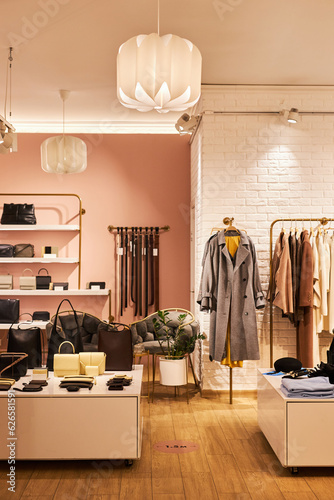 Quadro em tela Vertical background image of empty clothing boutique interior in elegant pink co