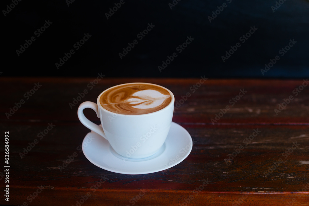 Stylish hot cappuccino concept with space for text. Delicious strong coffee in a white mug with space for text Stylish hot cappuccino concept with space for text. Delicious strong coffee in a white mug with space for text