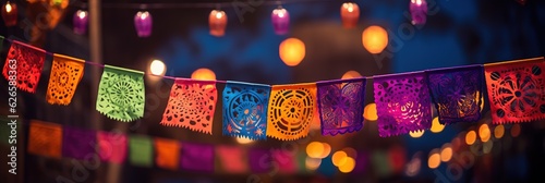 Colorful papel picado hanging on rope. National day of dead Mexico.  © Larisa