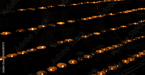 Burning candles in a Catholic Christian church